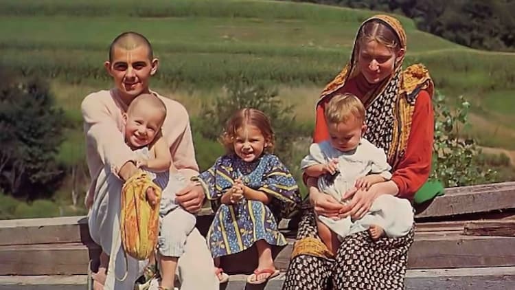 Family sitting together in devotional practice at home